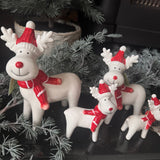 Glazed White Ceramic Reindeers wearing a Red &amp; white striped knitted Scarf &amp; matching bobble hat with a big smile &amp; red button nose
Available in 3 sizes - Small 10cm, Medium 14.5cm &amp; Large 17cm&nbsp;