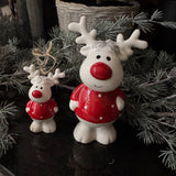 Christmas - Glazed Ceramic White standing Reindeer wearing a Red spotty jumper and with a Red nose H12cm