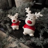 Christmas - Glazed Ceramic White sitting Reindeers wearing a Red spotty jumper and with a Red nose
Available in two sizes; - Small 9cm &amp; Large H12cm