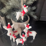 Christmas ceramic hanging decoration
Glazed White Ceramic Reindeer wearing a Red &amp; white striped knitted Scarf &amp; matching bobble hat with a big smile &amp; red button nose 8cm