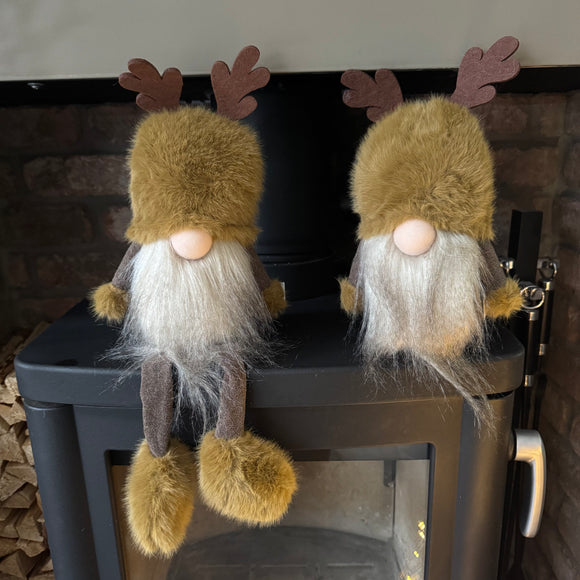 Woodland Sitting Gonk with rich brown body, ochre hue coloured fur hat with Antlers, fluffy beard & button nose. 
Available in 2 styles: Sitting & With dangly Legs