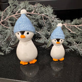 Christmas Fun ceramic glazed Penguins wearing a blue knitted bobble hat&nbsp;
Available in two sizes - Small 9.5cm &amp; Large 13cm