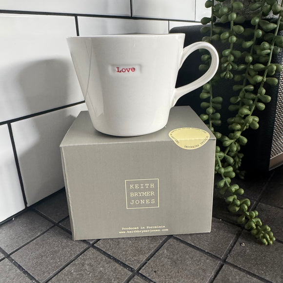 Keith Brymer Jones Word Range Medium Bucket White Porcelain Mug 350ml with handstamped quote
Colour font - Red
Quote - Love