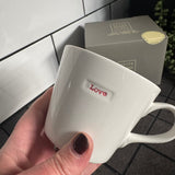 Keith Brymer Jones Word Range Medium Bucket White Porcelain Mug 350ml with handstamped quote
Colour font - Red
Quote - Love