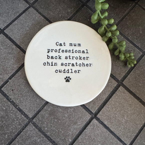 White glazed Ceramic Round Coaster 10cm with black text
Quote - 'Cat mum professional back stroker chin scratcher cuddler' with paw print illustration