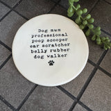 White glazed Ceramic Round Coaster 10cm with black text
Quote - 'Dog mum professional poop scooper ear scratcher belly rubber dog walker' with paw print illustration