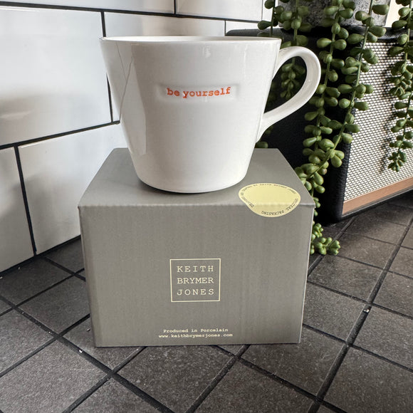 Keith Brymer Jones Word Range Medium Bucket White Porcelain Mug 350ml with handstamped quote
Colour font - Orange
Quote - be yourself
