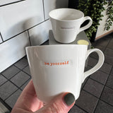 Keith Brymer Jones Word Range Medium Bucket White Porcelain Mug 350ml with handstamped quote
Colour font - Orange
Quote - be yourself
