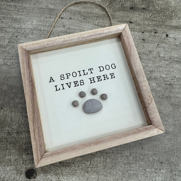 Small Hanging Wooden 13cm square Sign
Quote as follows; 'a spoilt dog lives here'
Illustration of a Pebble pawprint 