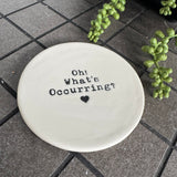 White glazed Ceramic Round Coaster 10cm with black text
Quote - 'Oh! What's Occurring?' with heart illustration