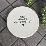 White glazed Ceramic Round Coaster 10cm with black text
Quote - 'Oh! What's Occurring?' with heart illustration