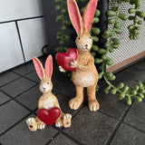 Sitting Ruth Rabbit Holding a Red Heart