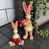 Sitting Ruth Rabbit Holding a Red Heart