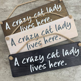 The Giggle Gift Co - Made in the UK
Wooden Hanging Sign L29.5cm
Quote; "Crazy cat lady lives here"