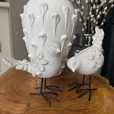 Glazed neutral Ceramic Standing Bird Ornament With Texture Detail and iron legs
Available in two styles - looking down H14.5cm &amp; looking upwards H12.6cm