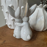 Small neutral Rabbits holding a heart