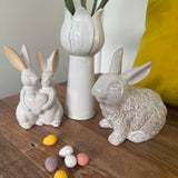 Small neutral Rabbits holding a heart