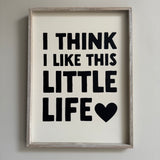 Quotable hanging wooden framed sign 40cm;
Quote in bold black text on white vinyl 'I Think I like this little life'