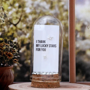 Attic Creations - giftings life's precious moments since 2010;
Message in a Bottle Sterling Silver Earrings handmade in Devon
Style - Silver&nbsp; north star shaped stud earrings&nbsp;
Quote on the card - 'I thank my lucky stars for you'