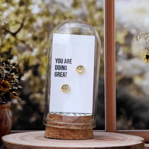Attic Creations - giftings life's precious moments since 2010;
Message in a Bottle Sterling Silver Earrings handmade in Devon
Style - Gold Smile shaped stud earrings 
Quote on the card - 'You are doing great'