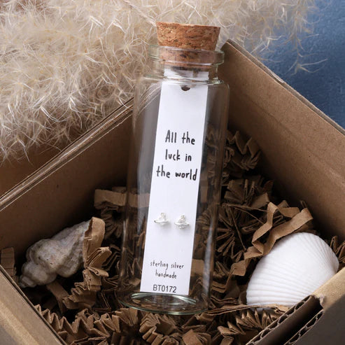 Message in a Bottle Sterling Silver Stud Earrings handmade in Devon
Style - Planet earrings with an inlaid with clear diamante crystal 
Quote on the card - 'All the luck in the world'