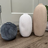 Terracotta rough round small vases with mottled pattern
Available in 3 sizes &amp; colours;
Round Grey/Black H11cm&nbsp;
Slim White H17cm
Tall Slim Light Tan H23.8cm