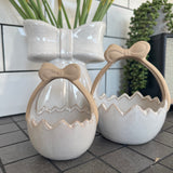 Glazed Ceramic Neutral Easter Egg basket with unglazed bow Handle&nbsp;
Available in 2 sizes; Small 12cm &amp; Large 15cm