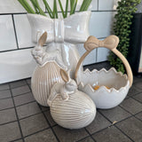 Glazed Ceramic Neutral Rabbit sat on a Ribbed Easter Egg Standing&nbsp;
Available in 2 sizes; Small 9cm &amp; Large 17cm