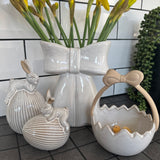 Glazed Ceramic Neutral Easter Egg basket with unglazed bow Handle&nbsp;
Available in 2 sizes; Small 12cm &amp; Large 15cm