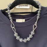 Eliza Gracious quality affordable design led branded costume jewellery

Tigers Eye effect large beads with twin link decoration Short necklace
Colour - Grey