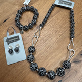 Eliza Gracious quality affordable design led branded costume jewellery

Tigers Eye effect large beads with twin link decoration Short necklace
Colour - Grey