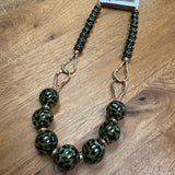 Eliza Gracious quality affordable design led branded costume jewellery

Tigers Eye effect large beads with twin link decoration Short necklace
Colour - Green