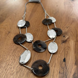 Eliza Gracious quality affordable design led branded costume jewellery

Long double strand necklace with Grey marble resin discs, matt silver oval metal discs, attached with silver slim bars and grey twine

New SS26 EG Collection
EN1057