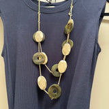 Eliza Gracious quality affordable design led branded costume jewellery

Long double strand necklace with Olive green marble resin discs, matt gold oval metal discs, attached with gold slim bars and green twine

New SS26 EG Collection