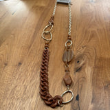 Eliza Gracious quality affordable design led branded costume jewellery

Mix of Brown Resin different size discs &amp; shapes with a chain link and matt gold chain &amp; link long Necklace&nbsp;

New SS26 EG Collection
EN1068