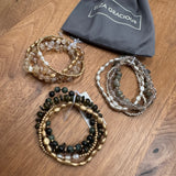Eliza Gracious quality - affordable design led branded costume jewellery.

Multi stranded beaded stretch Bracelet&nbsp;
Available in 3 colours;
Grey &amp; Silver
Cream &amp; Gold
Dark Green &amp; Gold