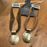 Eliza Gracious quality affordable design led branded costume jewellery

Short multi strand suede necklace with a pale gold statement beaten disc&nbsp;
Available in 2 colours - Beige &amp; Green