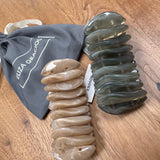 Eliza Gracious quality - affordable design led branded costume jewellery.

Slim polished smooth resin pieces forming a resin stretch bracelet&nbsp;

Available in 2 colours; Cream &amp; Grey