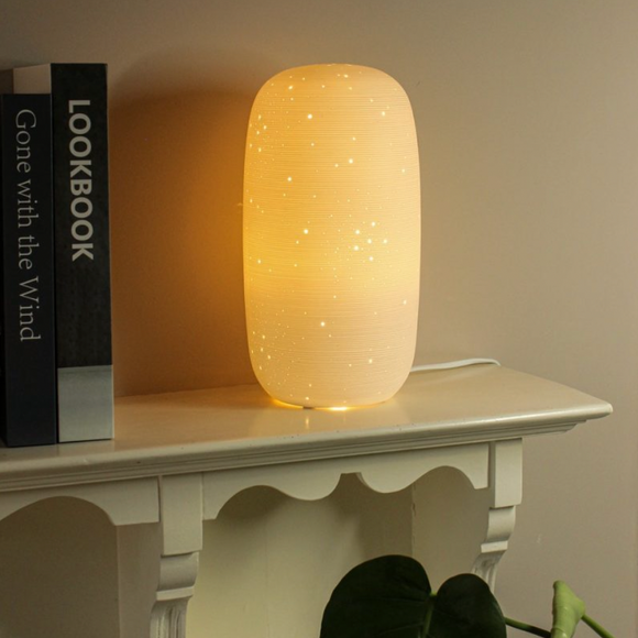 Light Glow White Ceramic Lamp - Tall Starry  Table lamp glazed in a white colour and in a tall round cylindrical shape, featuring starry round dots.