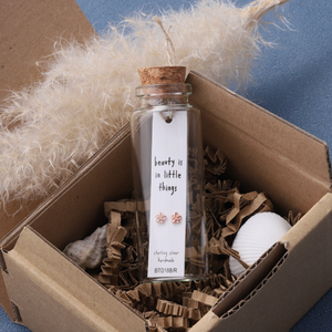 Attic Creations - giftings life's precious moments since 2010;



Message in a Bottle Sterling Silver Stud Earrings handmade in Devon
Style - Rose Gold sweet little flower ear studs&nbsp;
Quote on the card - 'Beauty is in the little things'