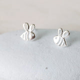 Sweet bumble bee stud earrings presented in a lovely message bottle with a card that reads "bee you bee happy"  Sterling Silver