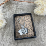 A stylish metal keyring in the shape of a bee with "you're the bees knees” on one side. gift boxed