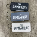 Made in the UK by Giggle Gift Co. Wooden block keyring with white text quote on both sides; 'The Summerhouse' 