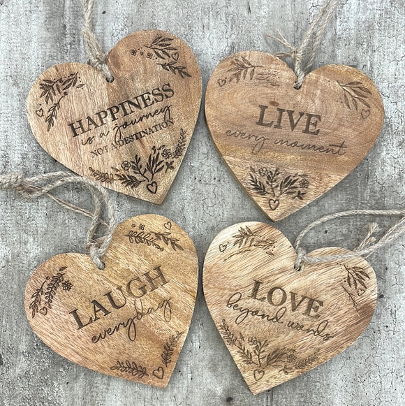 Quotable Hanging Wooden Hearts - 4 quotes Add these rustic hanging hearts to the home with their loving expressions. These 4 assorted hearts each display a different meaningful quote:  'Live every moment' 'Laugh every day' 'Love beyond words' 'Happiness is a journey not a destination'