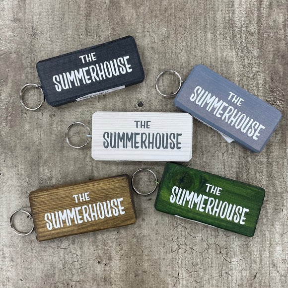 Made in the UK by Giggle Gift Co. Wooden block keyring with white text quote on both sides; 'The Summerhouse' 