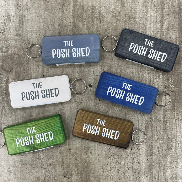 Made in the UK by Giggle Gift Co. Wooden block keyring with white text quote on both sides; 'The Posh Shed' 