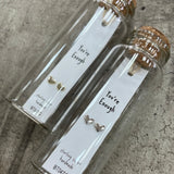 Sweet heart shaped stud earrings presented in a message bottle on a card that reads "you're enough"  Sterling Silver - available in gold or silver