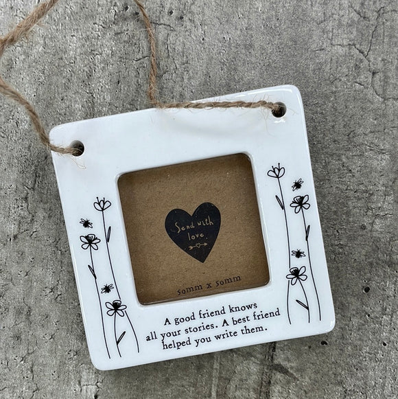 Beautiful white ceramic photo frame with floral detailing up the sides. In the middle is space for a small photo with quote 