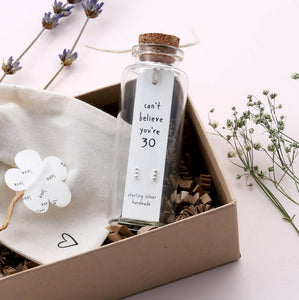 Sweet three dot bar shaped stud earrings - one dot for each decade. They are presented in a unique message bottle on a card that reads "can't believe you're 30"