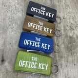 Made in the UK by Giggle Gift Co. Wooden block keyring with white text quote on both sides; 'The Office Key' 